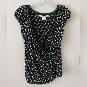 Black and white patterned wrap waist blouse